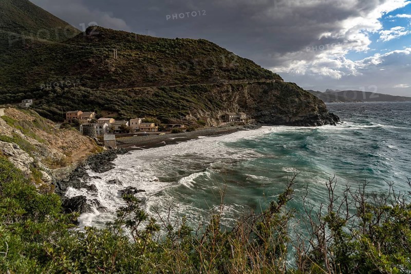 Beach and Genoese tower of La Marine de Negru on the west coast of Cap Corse, Corsica, France
