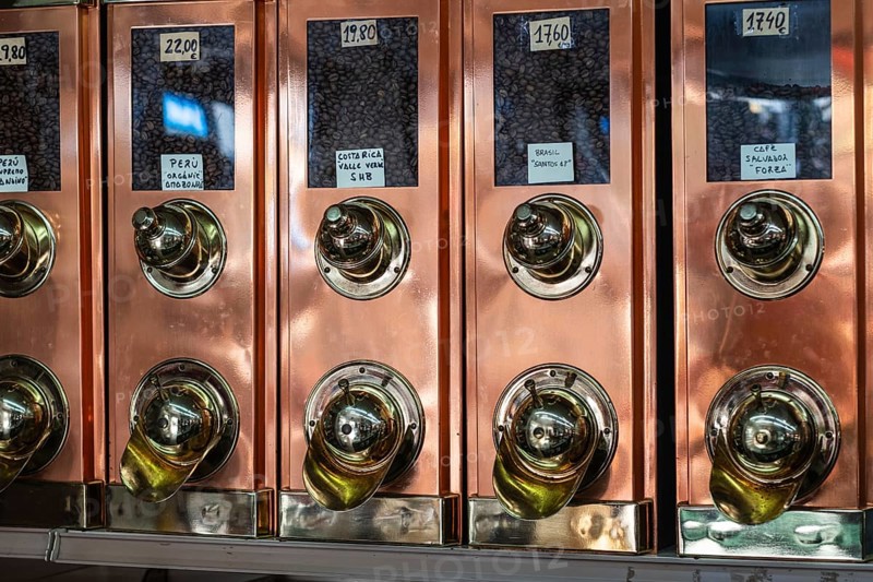 Old-fashioned brass coffee bean collector in a roastery in Barcelona, Spain