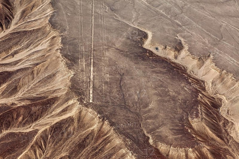 Dry, rocky landscape with line drawings captured from the air, the geoglyphs and drawings in the desert near Nasca and Palpa in Peru