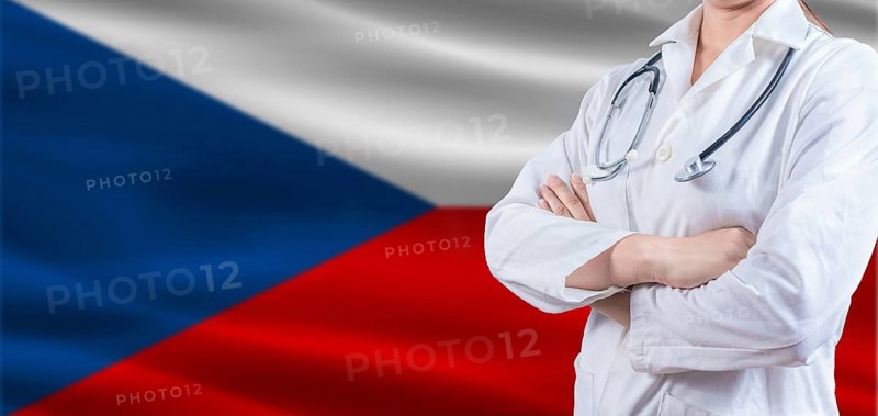 Doctor with crossed arms on Czech Republic flag. Czech Republic health and care concept. Female doctor on Czech Republic flag