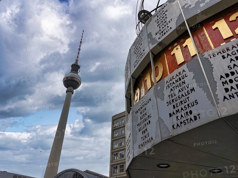 Cloudy sky over the Berlin World Clock and the Berlin TV Tower at Alexanderplatz, Alex, Mitte, Berlin