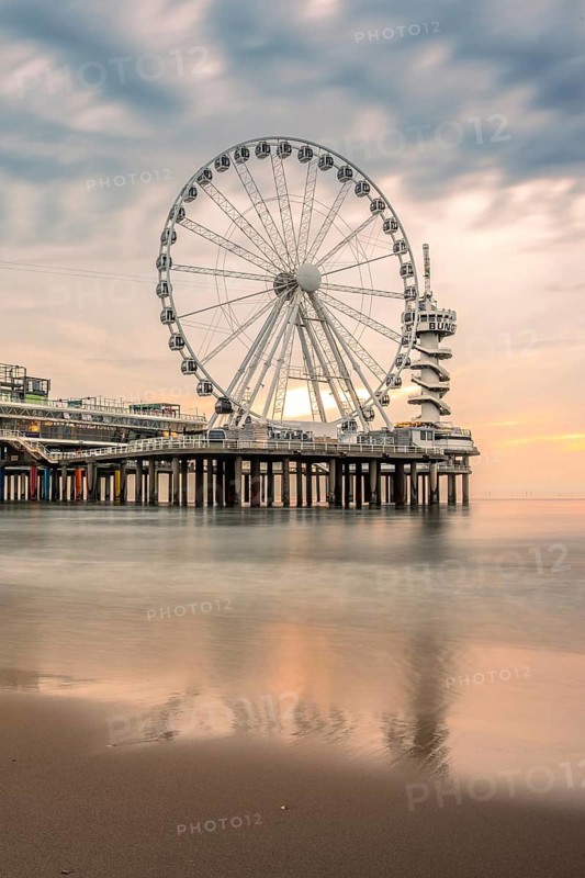 Ferris wheel at sunset on the pier at the beach, The Hague, Netherlands