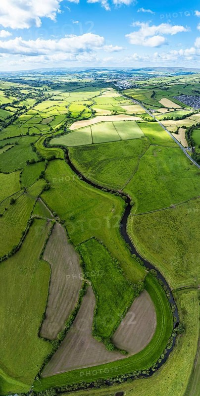 Vertical panorama of Farms and Fields over Cononley and River Aire from a drone, Keighley, North Yorkshire, England, United Kingdom