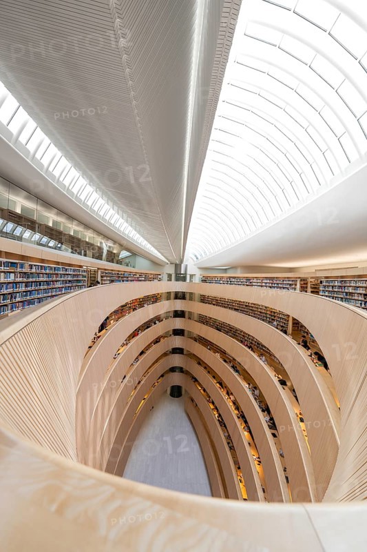 Large, modern library with spiral-shaped architecture and bright glass roof, University Law Library, Zurich, Switzerland