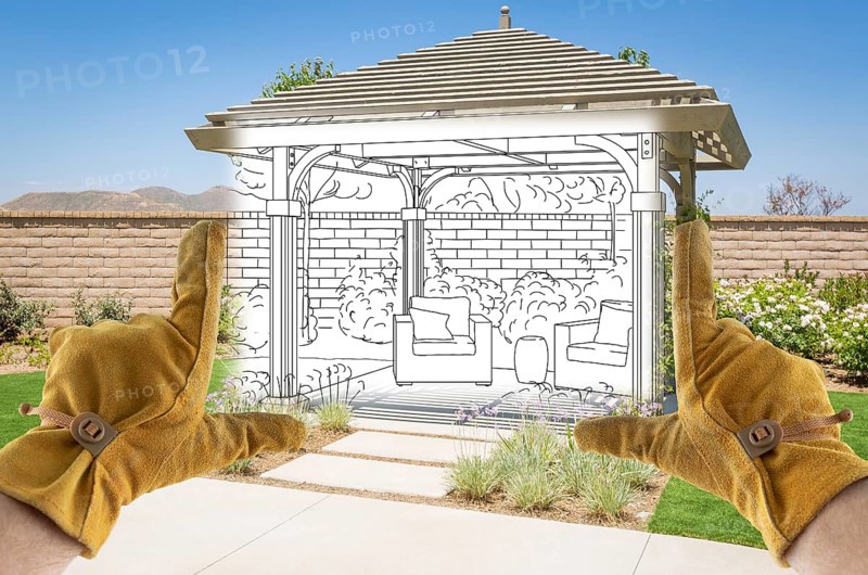 Male Contractor Hands Framing Drawing Section of Custom Pergola Patio Cover Design Drawing