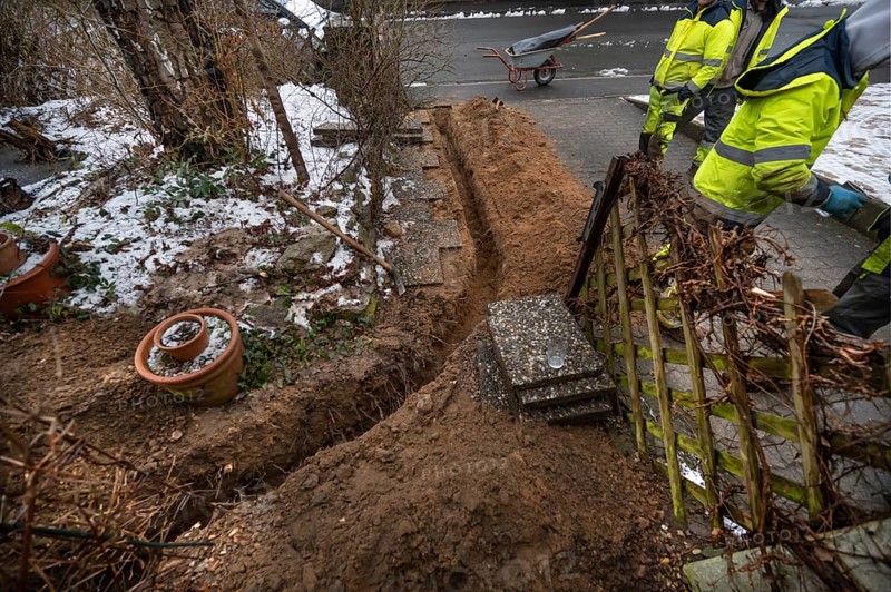 Excavation to lay Telekom's fiber optic cables in a residential building, Eckental, Middle Franconia, Bavaria, Germany