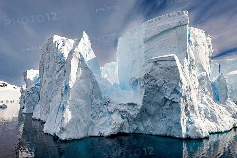 Majestic, towering icebergs with sharp edges against a dark sky, icebergs in the landscape of the Southern Ocean in Antarctica