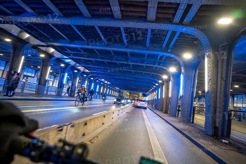Cycling in the city, in the dark, in the evening, cycling underpass at the main train station, in downtown Essen, North Rhine-Westphalia, Germany