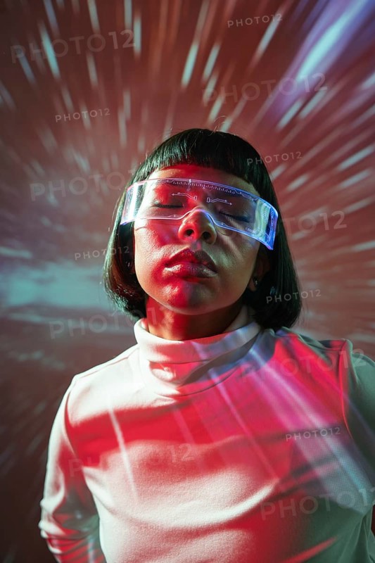 A Latin woman is immersed in a captivating virtual reality experience, wearing futuristic VR glasses. The background has dynamic lighting effects, adding to the experience