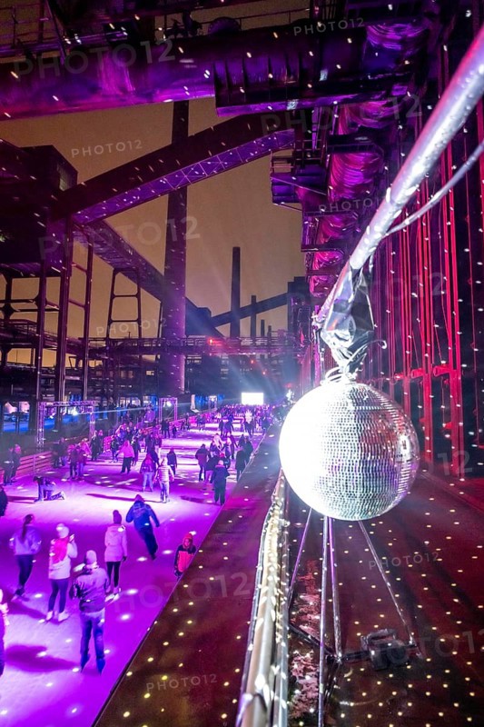 Ice rink at the Zollverein coking plant, ice skating with music and many lighting effects, Essen, North Rhine-Westphalia, Germany