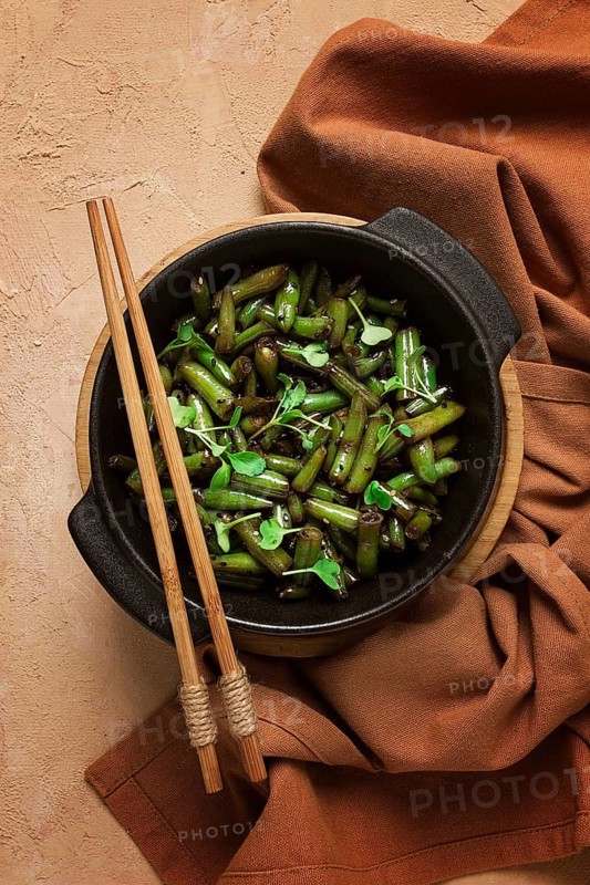Fried bean pods, in soy sauce, with sesame seeds, homemade, no people