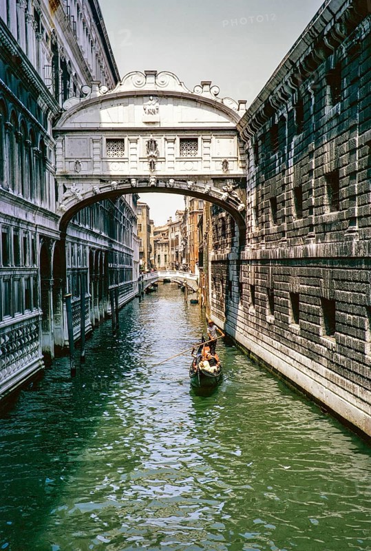 Gondolier, gondola boat on the canal, Ponte dei Sospiri, Bridge of Sighs, Venice, Italy 1969