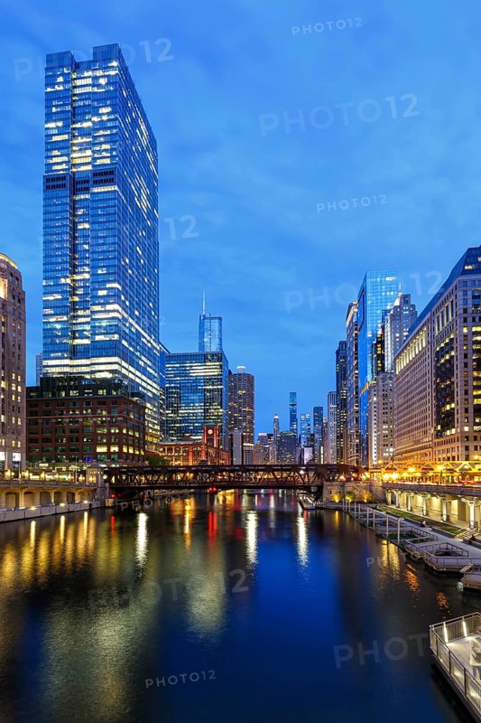 Skyline skyscrapers skyscrapers on the Chicago River bridge at night in Chicago, USA