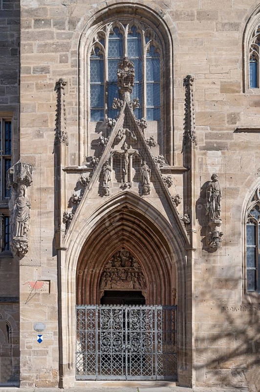 Gothic side entrance portal with the tympanum of the Entombment of Mary, St Andrew's Church, Weißenburg, Middle Franconia, Bavaria, Germany