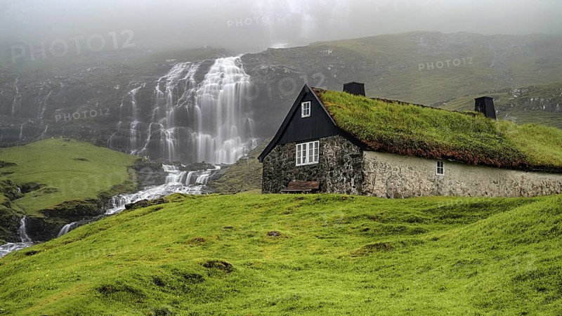The waterfall with a view of Saksun, Faroe Islands, Denmark, Faroe Islands, Denmark