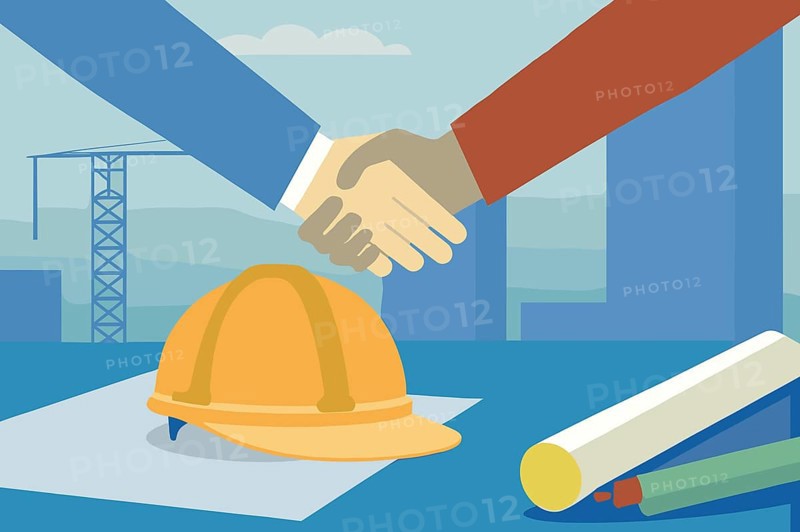 Two individuals engage in a handshake to signify a partnership in real estate while surrounded by construction tools and a city skyline in daylight
