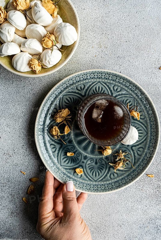 Indulge in homemade vanilla mini zephyr-marshmallows filled with delectable rose jam Paired perfectly with a refreshing iced coffee liqueur drink, creating a delightful treat