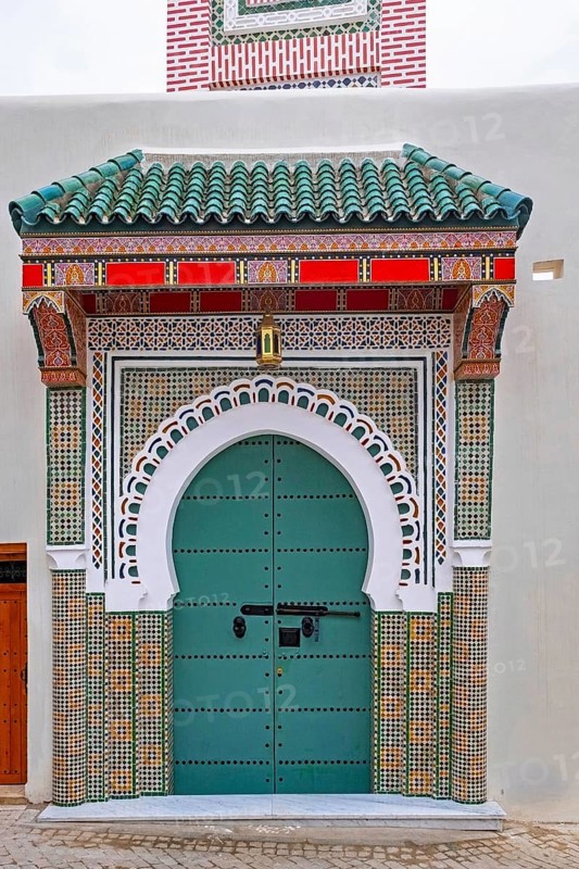 Decorated green door, entrance to mosque in medina of the city Tangier, Tanger, Morocco
