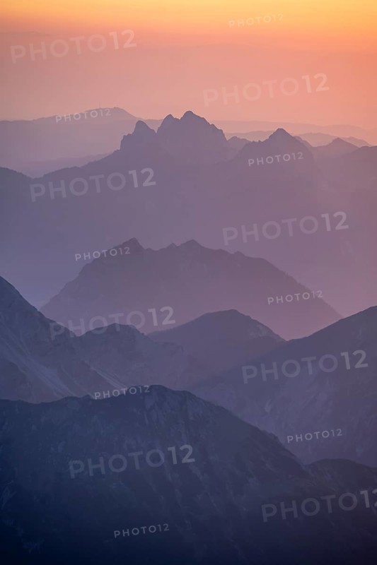 Silhouettes of mountains at sunset, view from the summit of the Zugspitze, Wetterstein Mountains, Northern Limestone Alps, Bavaria, Germany