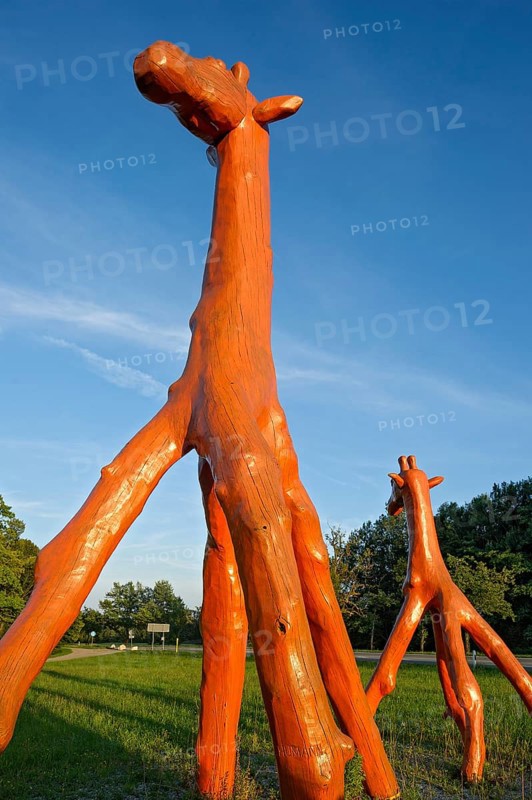Giraffes made of red painted tree trunks, wooden sculpture by Günter Schumann, Museum of the Imagination by Lothar-Günther Buchheim, Bernried am Starnberger See, Upper Bavaria, Bavaria, Germany