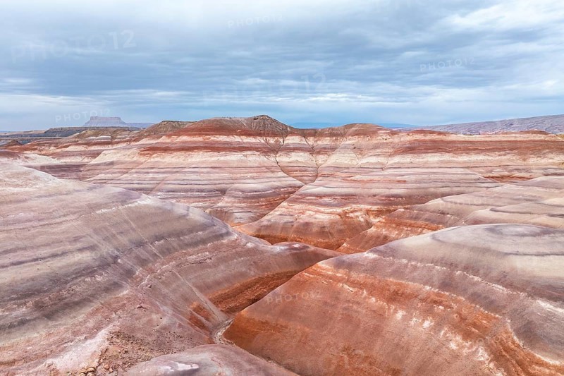 Captivating aerial shot of the vibrant and textured rock formations in Hanksville, Utah, showcasing the natural beauty and diverse geology of the area