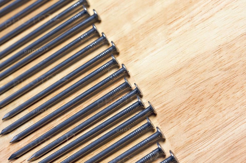 Macro of Nails on a Wood Background