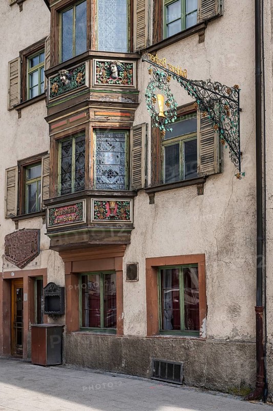 Detailed view of the former Gasthaus zum goldenen Becher in the historic old town of Rottweil, which was already mentioned as an inn in 1713. The wooden bay window was artfully decorated by the well-known German sculptor and mask carver German Burry, Rottweil district, Baden-Württemberg, Germany