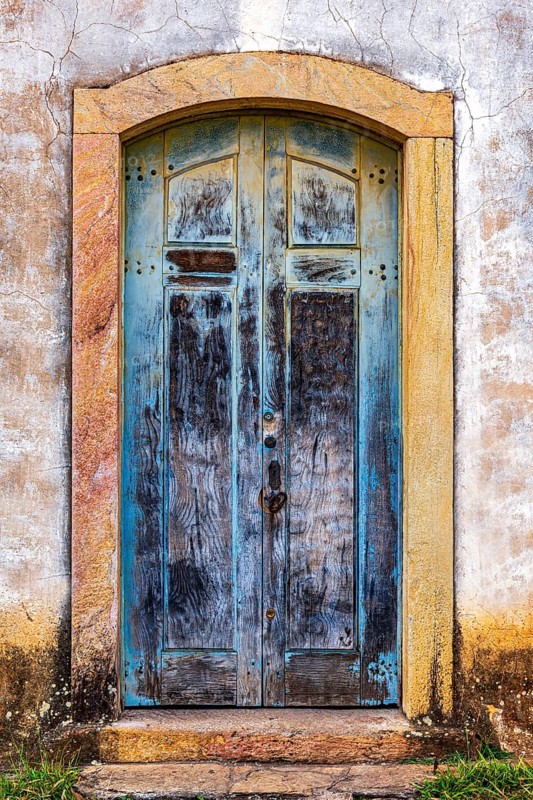 Carved wooden gate in an old baroque church in the city of Ouro Preto in Minas Gerais