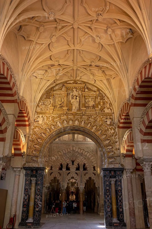 A richly decorated interior of the cathedral mosque of Córdoba (Mezquita-Catedral), with Gothic vaults and detailed arches, Cordoba, Andalusia, Spain