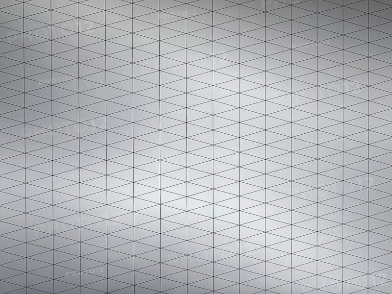 Geometric layout featuring interconnected triangular patterns on a gray metallic surface. The design highlights modern symmetry and minimalism, suitable for backgrounds or architectural concepts