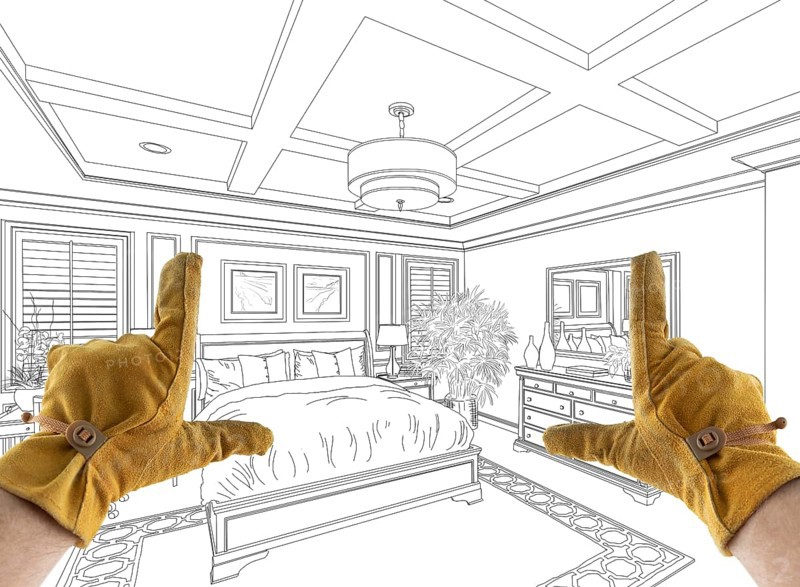 Male Contractor Hands Framing Over Custom Master Bedroom Design Drawing