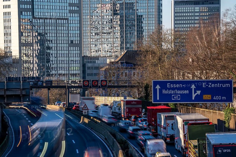The A40 motorway, Ruhrschnellweg, in Essen, city skyline, Evonik office building, traffic jam in the westbound lane, Duisburg, slow traffic, North Rhine-Westphalia, Germany