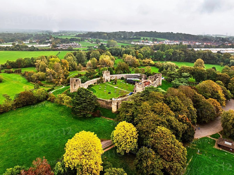 Autumn Colours over ruins of Caldicot Castle from a drone, Caldicot, Monmouthshire, Wales, UK