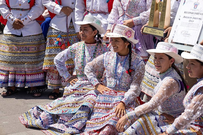 Arequipa, Peru, 2 February, 2026: Native indigenous people of Peru in National costumes perform dances and take images with people in Plaza de Armas in Arequipa, Peru