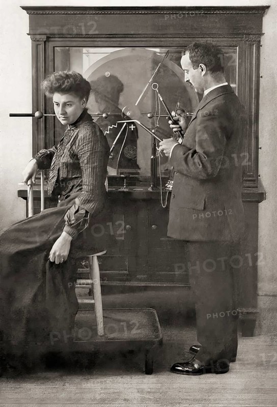 A patient being treated by Proffessor Wilhelm Conrad Röntgen with a direct spark treatment, an early electric medical Electro-Therapeutics