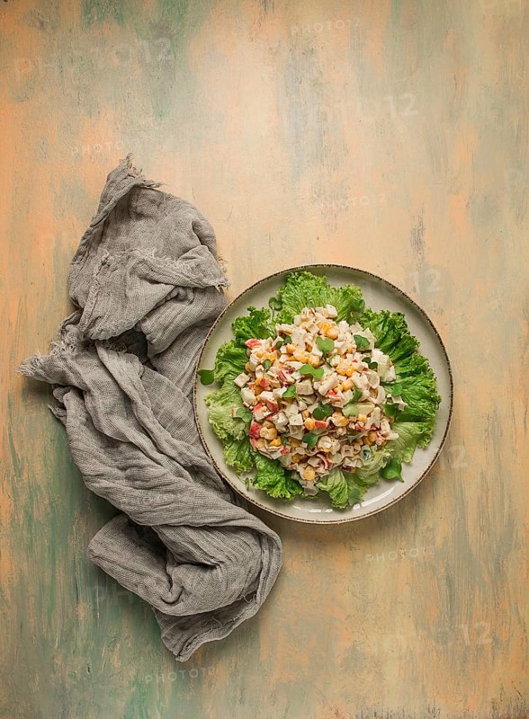 Canned corn salad, with crab sticks, top view, no people