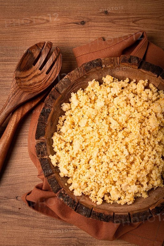 Cooked couscous, in a wooden bowl, top view, no people