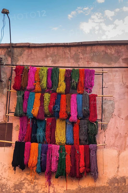 Wool for drying in the dyer's souk, colours, basic colours, presentation, wall, facade, house facade, Arabic, oriental, dyeing, assortment, shop, market, medina, bazaar, culture, craft, traditional, Marrakech, Morocco