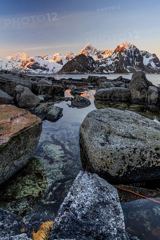 Sunrise, morning light, steep mountains by the sea, winter, Flakstadoya, Lofoten, Norway