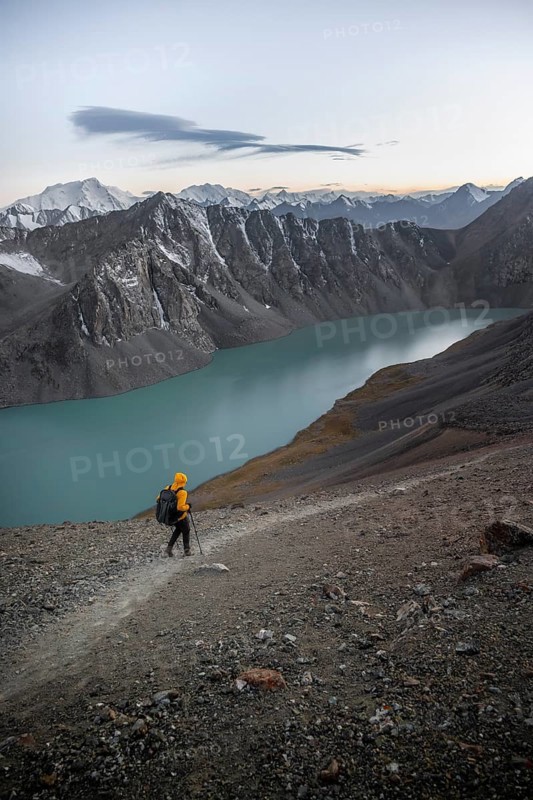 Mountaineer at Ala Köl mountain lake, in the Tien Shan Mountains, near Altyn Arashan, Kyrgyzstan
