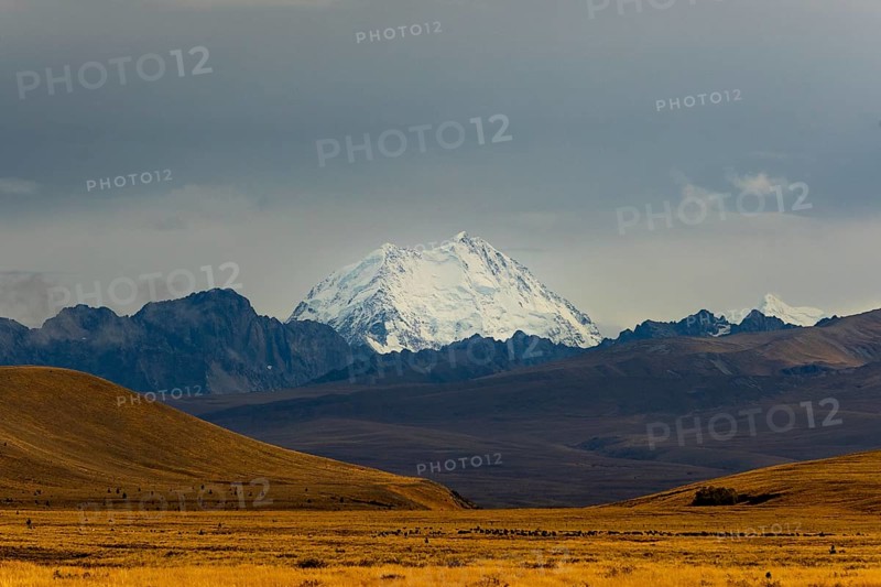 Majestic snow-capped Mount Cook surrounded by dramatic landscapes in the Canterbury region of New Zealand, showcasing natural beauty
