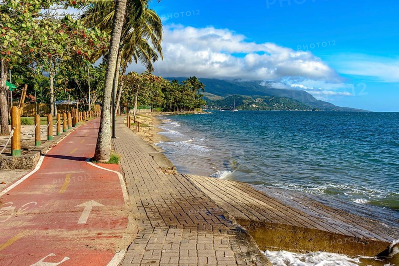 Bike path along the sea in the city of Ilhabela in Sao Paulo, Brazil