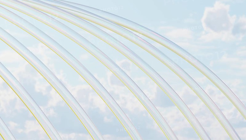 Elegant transparent arcs gracefully intersect against a serene cloudy sky, infused with subtle pastel hues The delicate interplay of light and color evokes a dreamy atmosphere