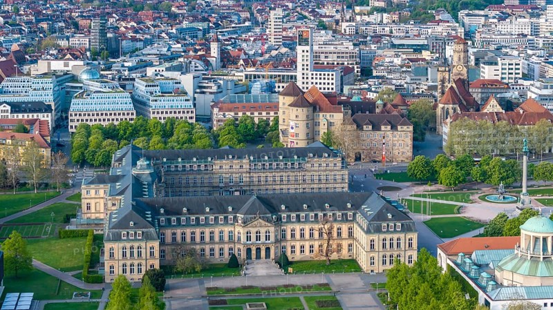 City view of Stuttgart. Aerial view. City centre on the Schlossplatz with New Palace, Old Palace and Collegiate Church. Stuttgart, Baden-Württemberg, Germany