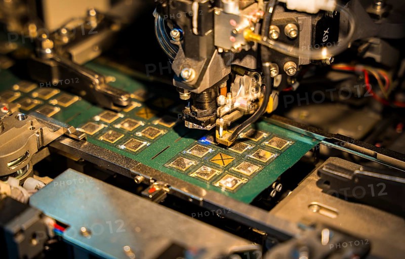 Robotic machine manufacturing semiconductor computer ship at a stall to show investors, during The Advantage Assam 2.0 Investment Summit in Guwahati, India on 25 February 2025