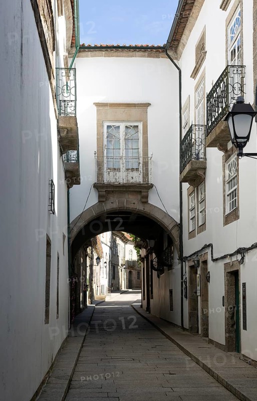 Narrow medieval street Rua de Santa Maria, city centre of Guimaraes, northern Portugal
