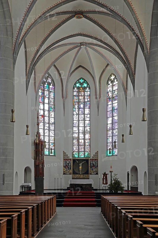 Chancel of the Gothic St. Clemens Church interior view, empty, pews, stained glass windows, Mayen, Vulkaneifel, Eifel, Rhineland-Palatinate, Germany