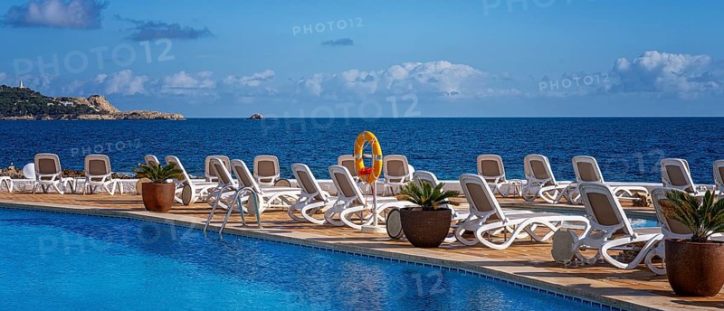 Swimming pool and sun loungers, Cala Rajada, Majorca, Spain