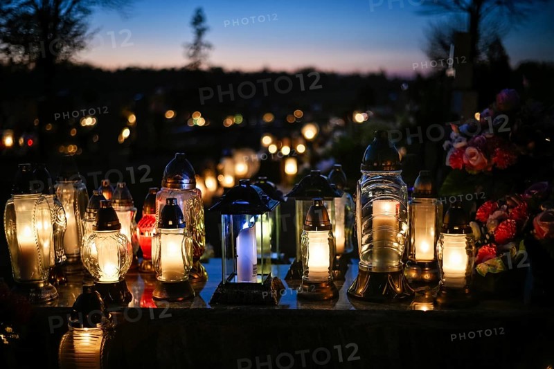 Lights on the grave on All Souls' Day
