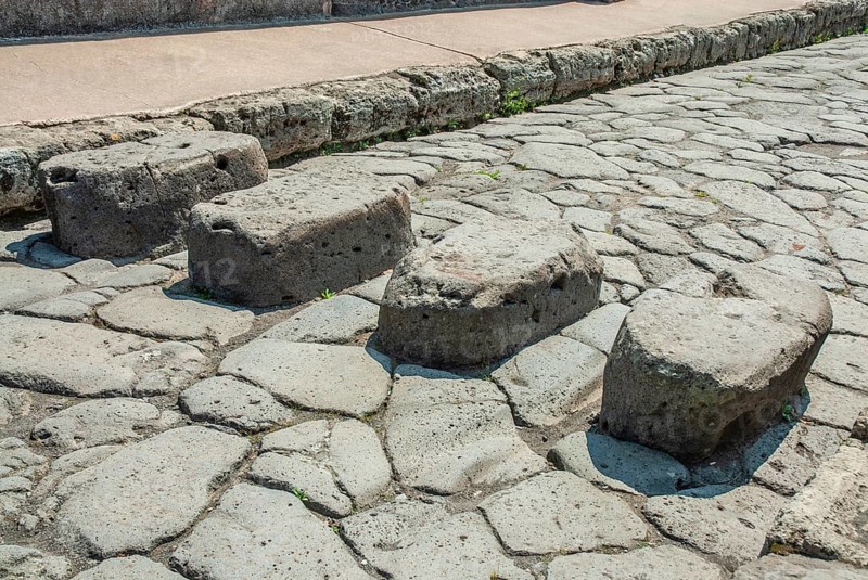 Stepping stones above perpetually flowing water needed to cross streets and keep the way clear for carts, archaeological site of Pompeii, UNESCO World Heritage Site, province of Naples, Campania, Italy, Southern Europe